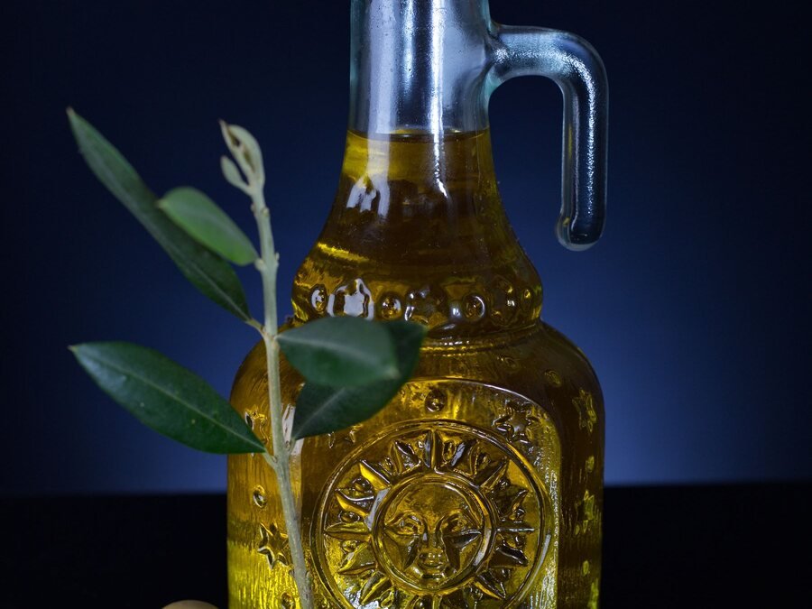 Olive oil bottle with olive branch